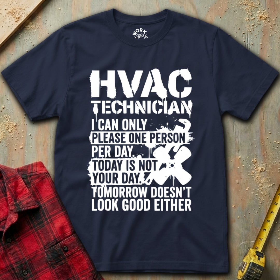 Navy blue t-shirt with white HVAC Technician text on a textured surface with tools.