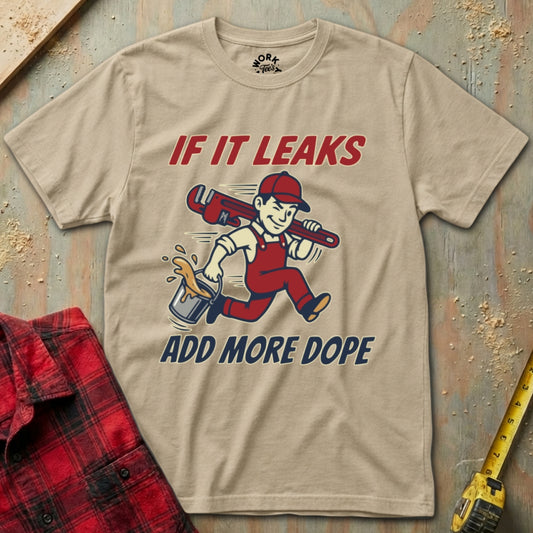 Beige t-shirt with graphic design and text on a wooden background