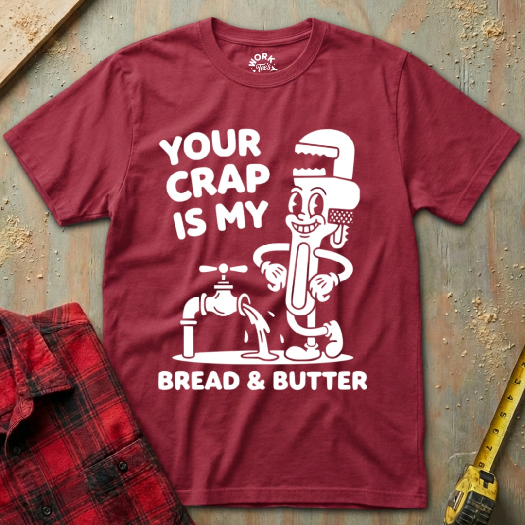 Maroon t-shirt with graphic design and text on a textured surface