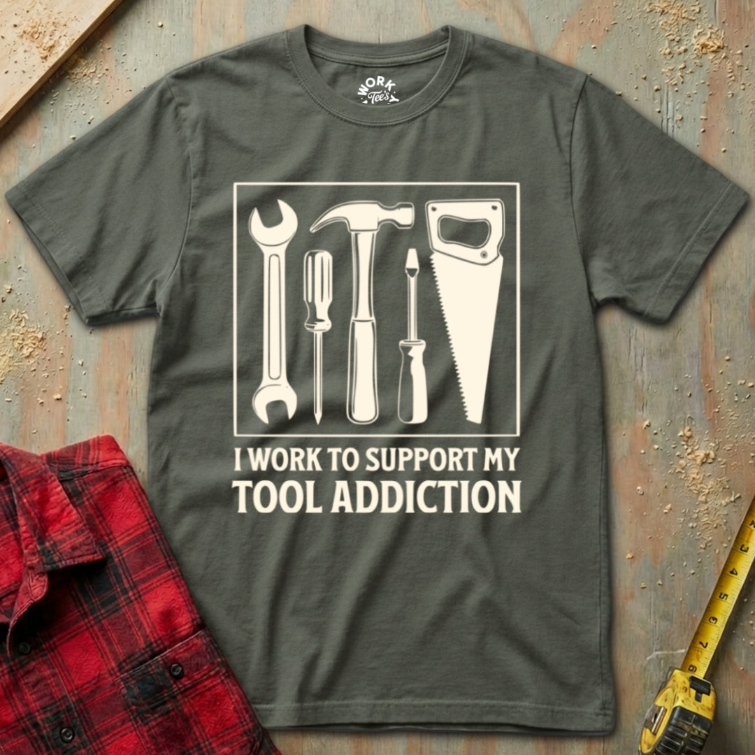 Gray t-shirt with tool graphic and text on a rustic background
