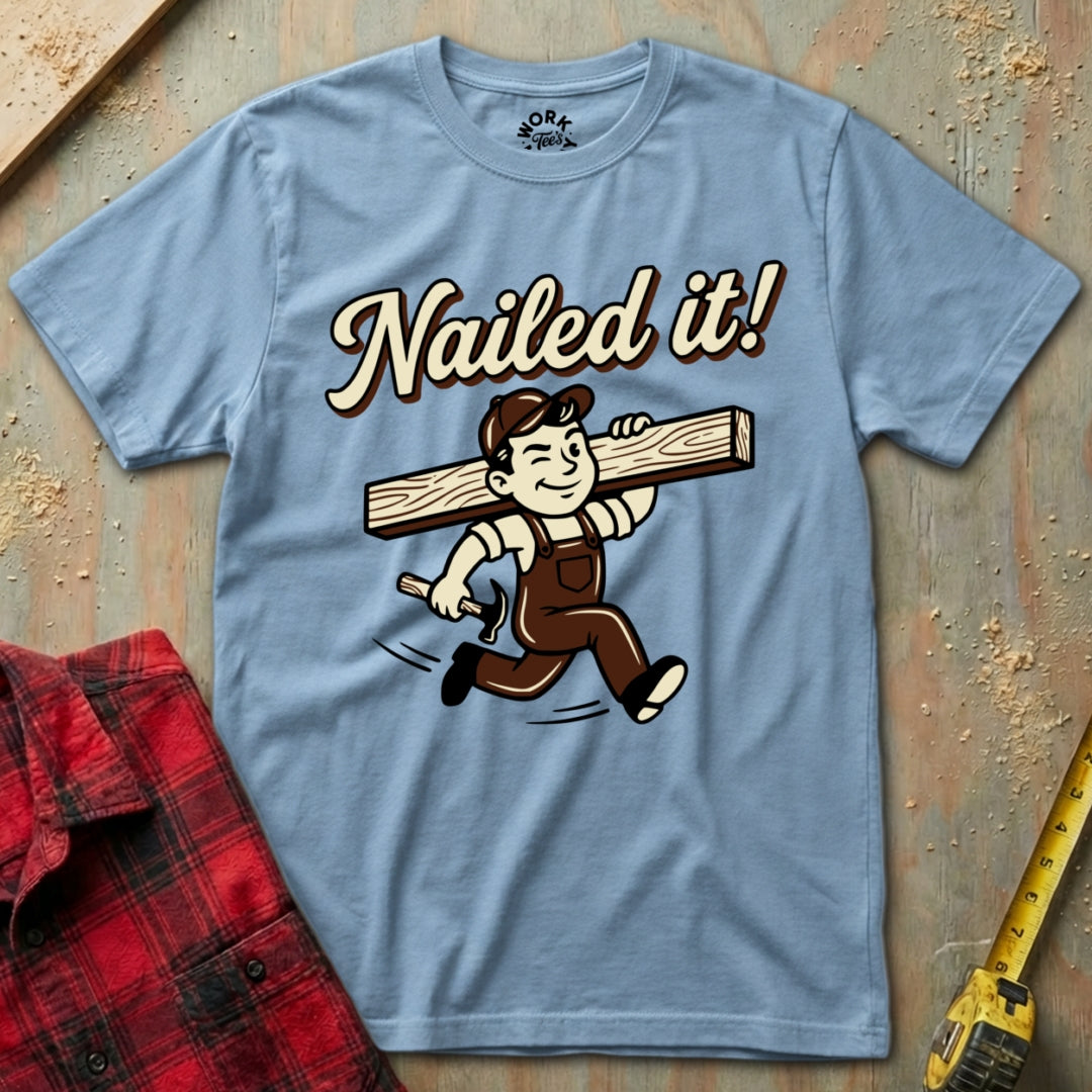 Blue t-shirt with 'Nailed it!' graphic on a wooden background