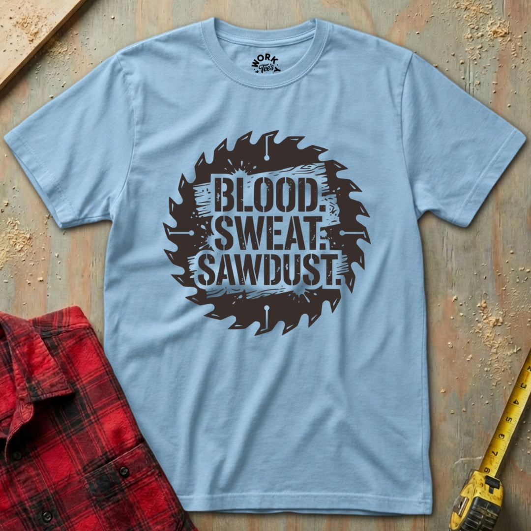 Light blue t-shirt with 'Blood Sweat Sawdust' graphic on a wooden background