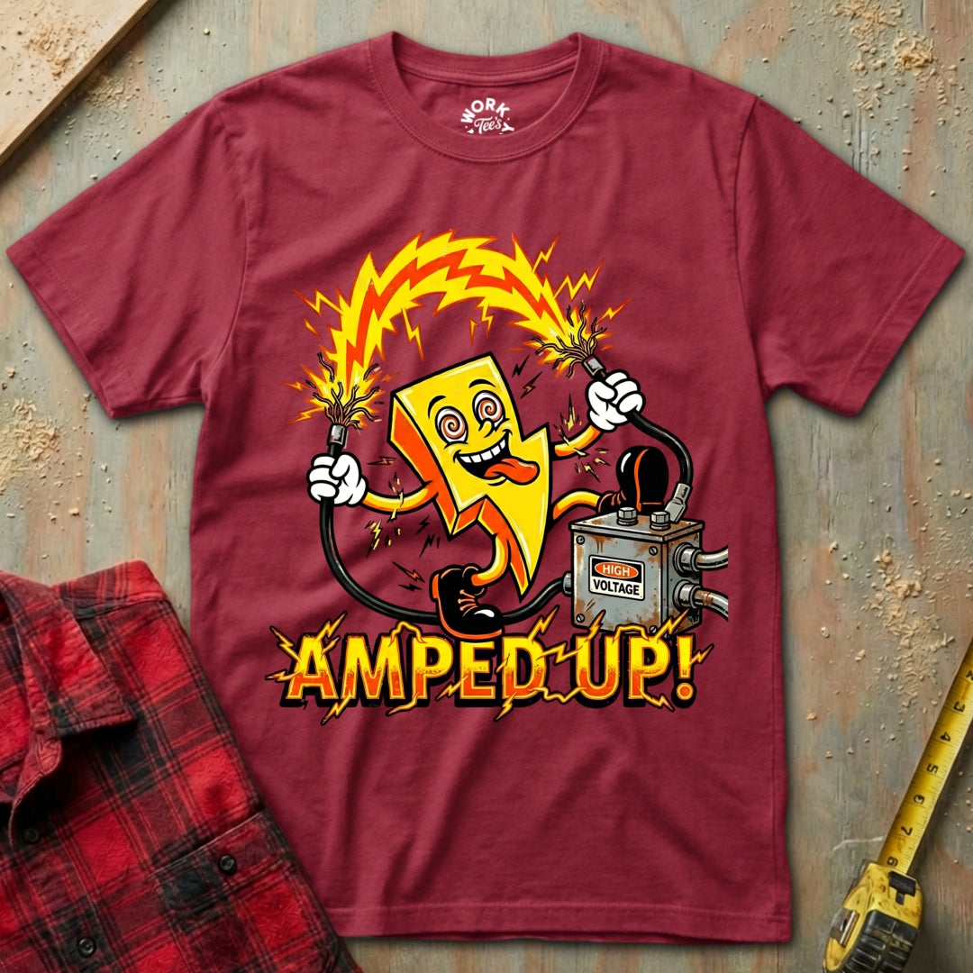 Maroon t-shirt with a cartoon character holding a battery and the text 'Amped Up!' on a textured surface.