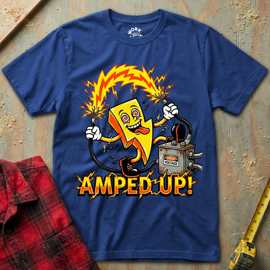 Blue t-shirt with a cartoon character holding a battery and the text 'Amped Up!' on a textured surface.