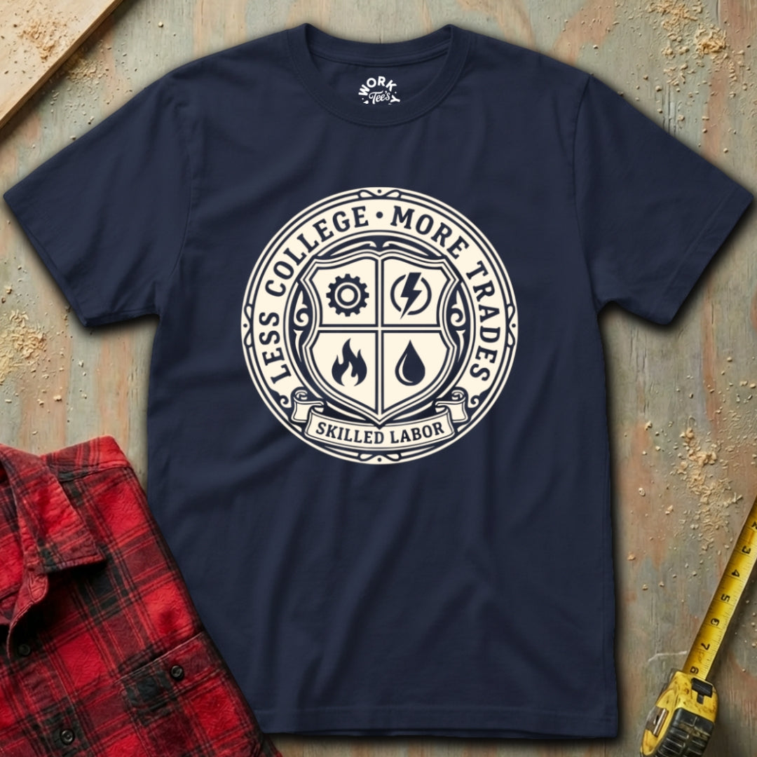 Navy blue t-shirt with a white graphic design on a textured surface with a red plaid shirt and yellow tool in the background.