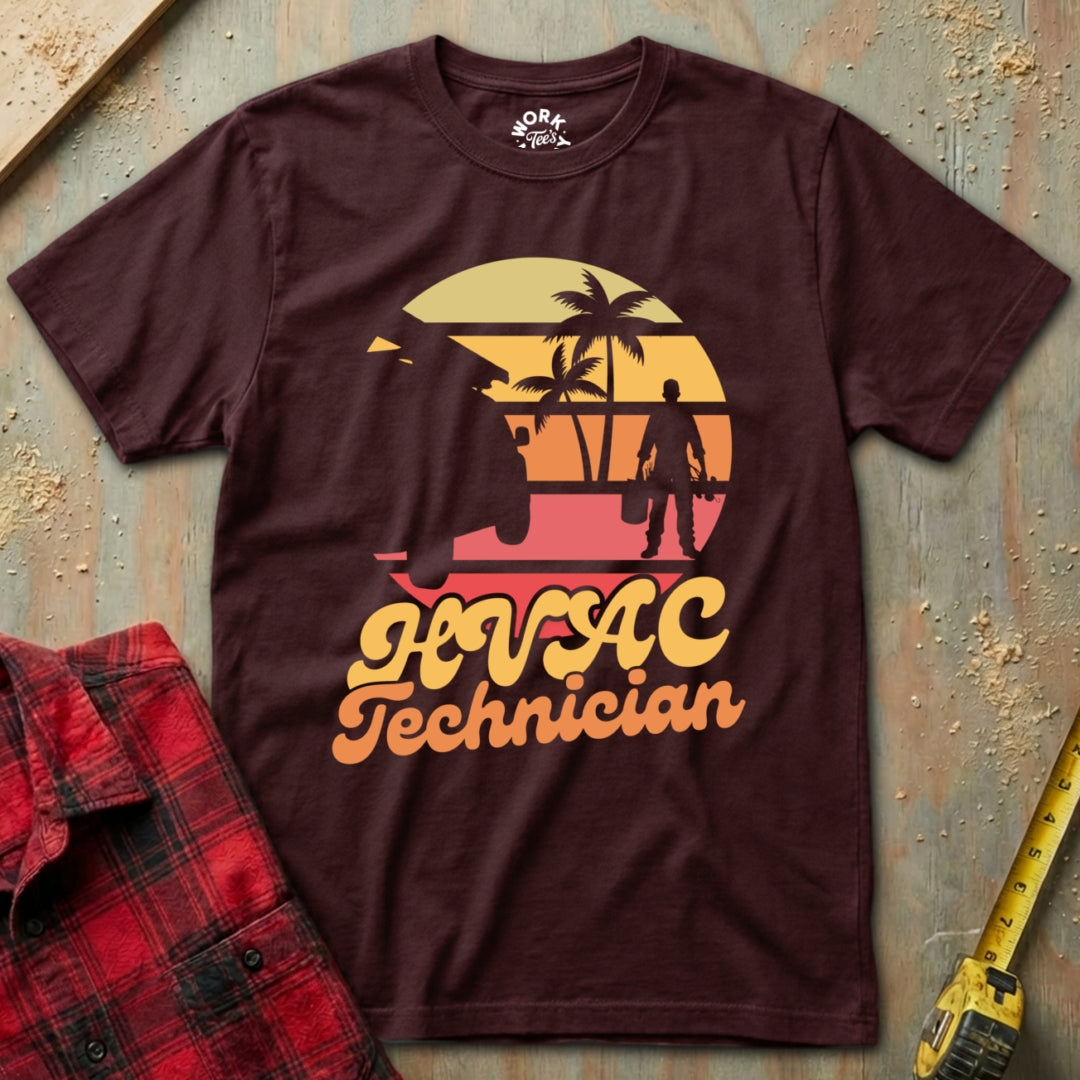 Maroon t-shirt with 'HVAC Technician' design on a textured surface with tools.