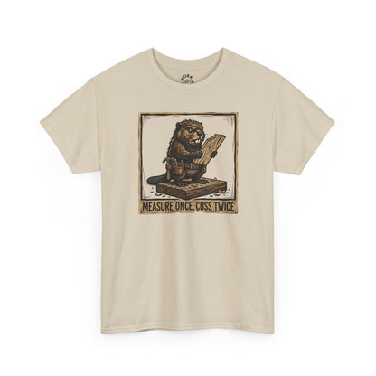 Beige t-shirt with graphic design of a lion holding a measuring stick and text on a white background