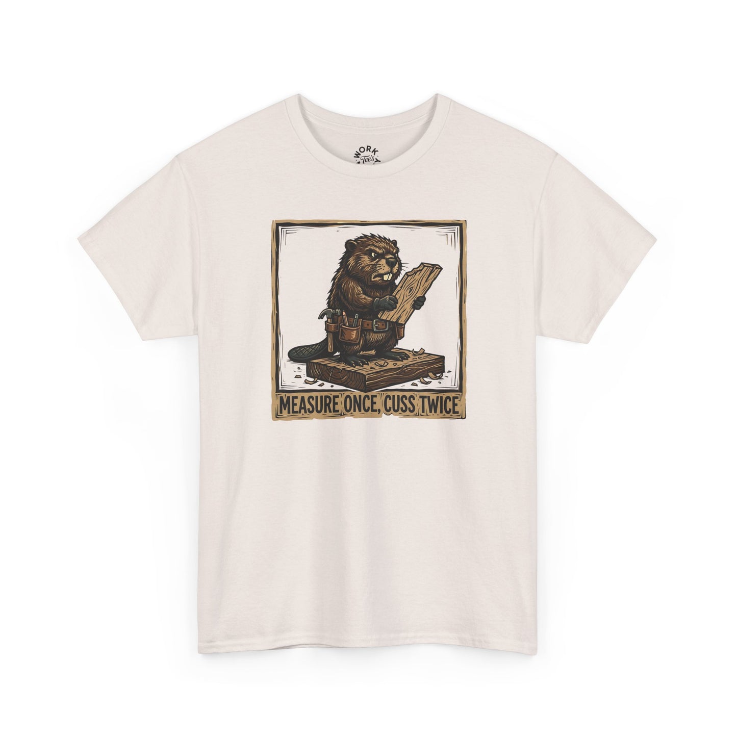 Beige t-shirt with a graphic of a lion holding a measuring device and text 'Measure once, cuss twice' on a white background.