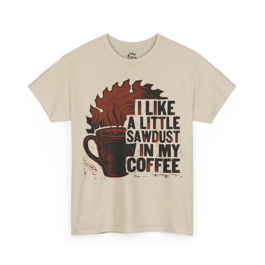 Beige t-shirt with graphic design and text 'I like a little sawdust in my coffee' on a white background