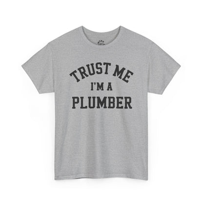 Gray t-shirt with 'Trust Me I'm a Plumber' text on a white background