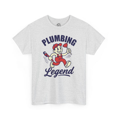 White t-shirt with cartoon character and 'Plumbing Legend' text on a white background