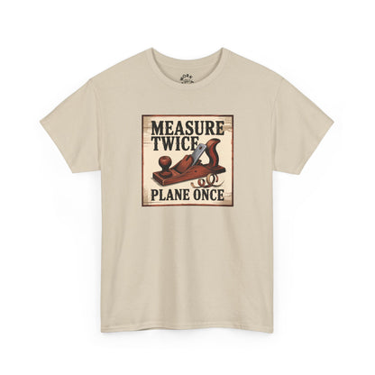 Beige t-shirt with a graphic of a plane and text 'Measure Twice, Plane Once' on a white background