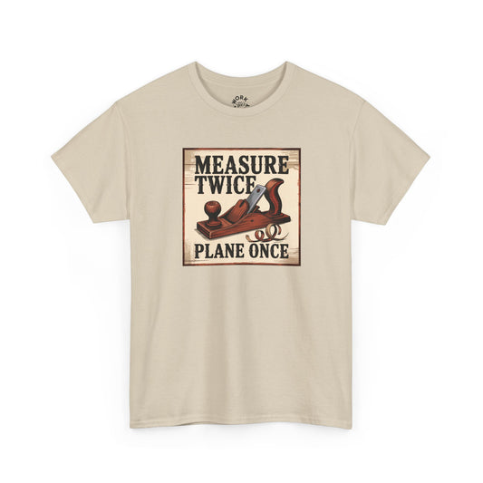 Beige t-shirt with a graphic of a plane and text 'Measure Twice, Plane Once' on a white background