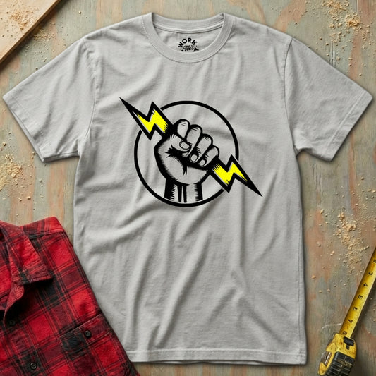 Gray t-shirt with a graphic design of a fist holding a lightning bolt on a textured surface.