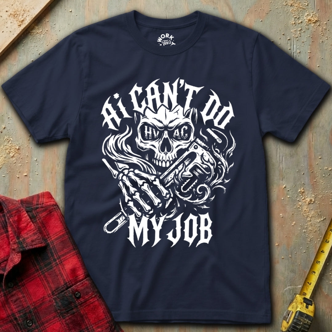 Navy blue t-shirt with a graphic design and text on a textured surface with a red plaid shirt and yellow tool in the background.