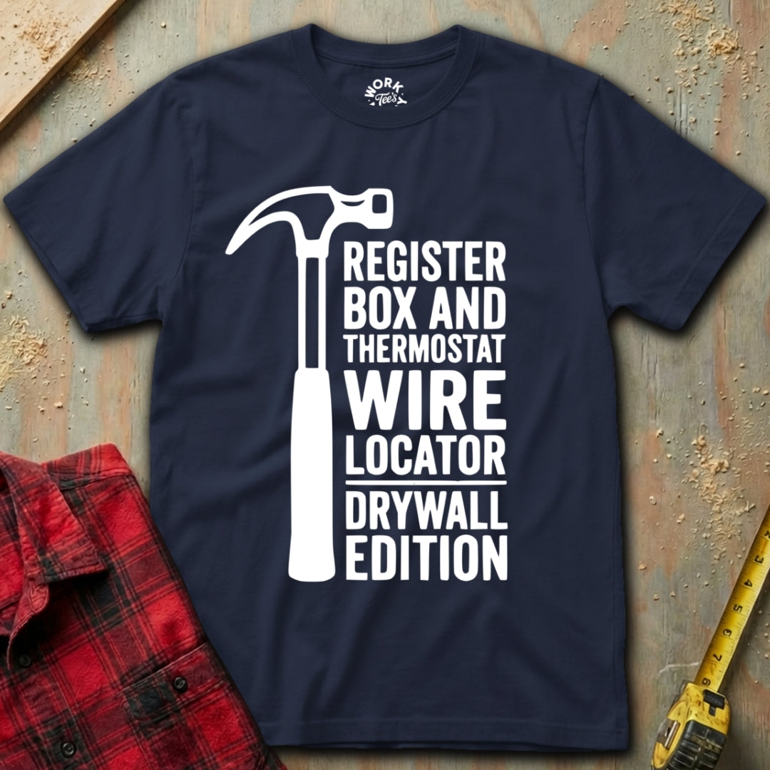 Navy blue t-shirt with white graphic and text on a textured surface with tools.