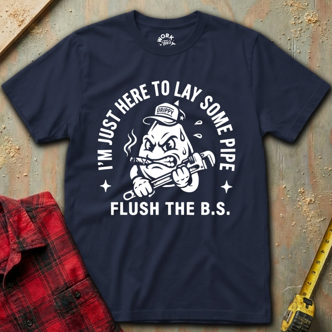 Navy blue t-shirt with white graphic and text on a textured surface with tools.
