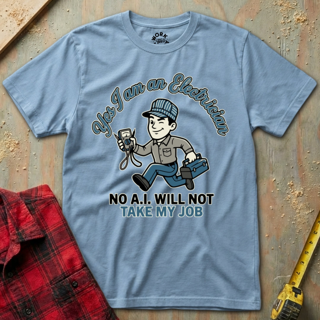 Blue t-shirt with electrician graphic and text on a wooden surface with plaid shirt and tape measure.