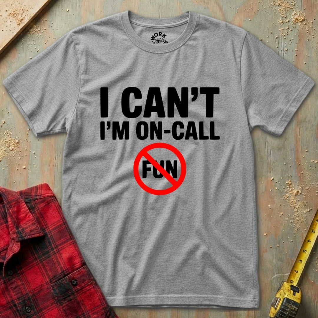 Sport Grey t-shirt with 'I Can't I'm On-Call Fun' text on a textured surface with a red shirt and tape measure.