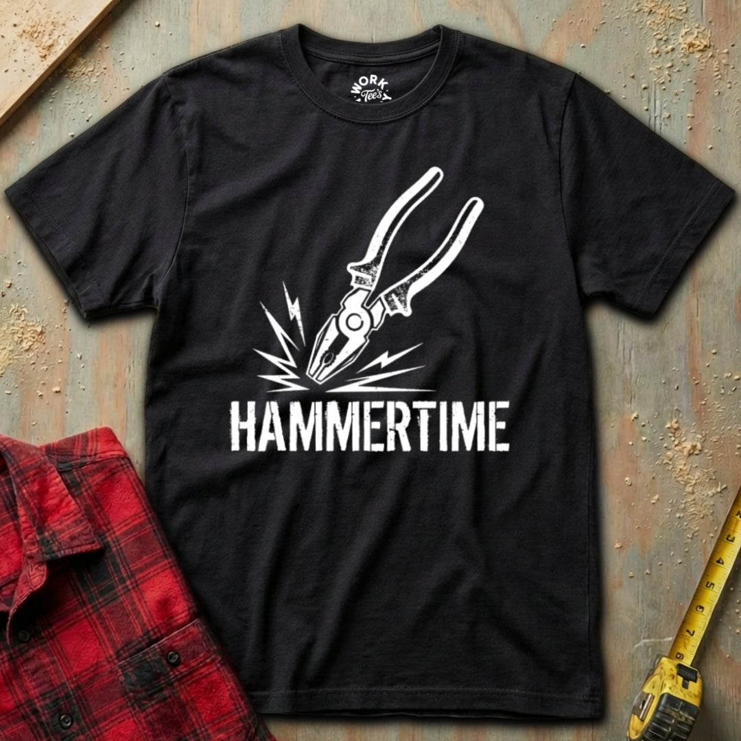 Black t-shirt with white graphic and 'HAMMERTIME' text on a textured surface with plaid shirt and tape measure.