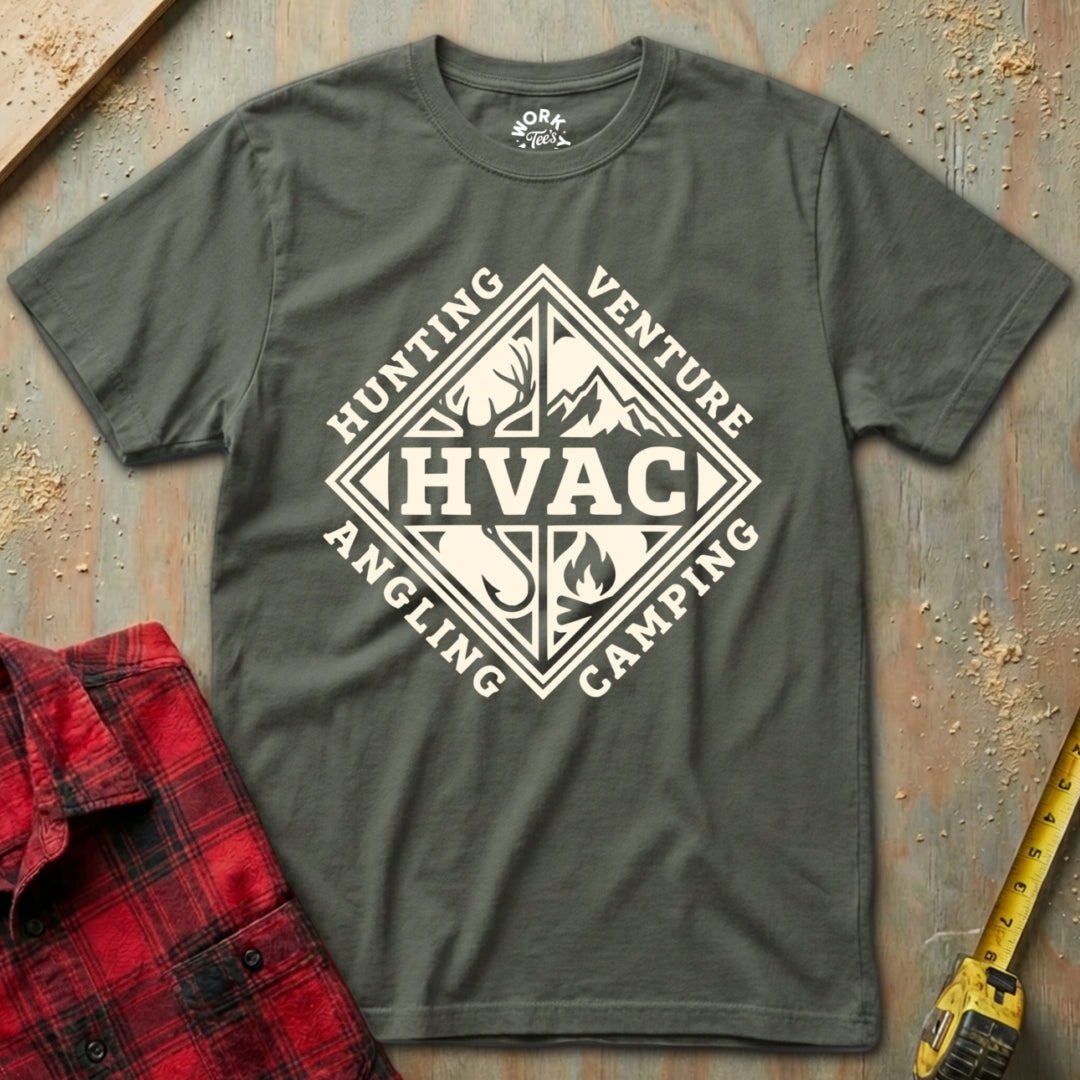Gray t-shirt with HVAC graphic design on a textured surface with red plaid shirt and yellow tool.