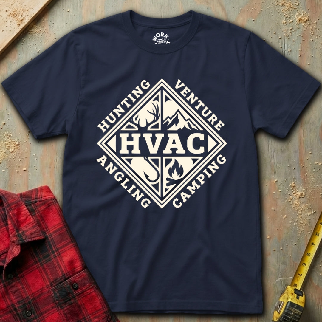 Navy t-shirt with white graphic design on a textured surface with red plaid shirt and yellow tool in background