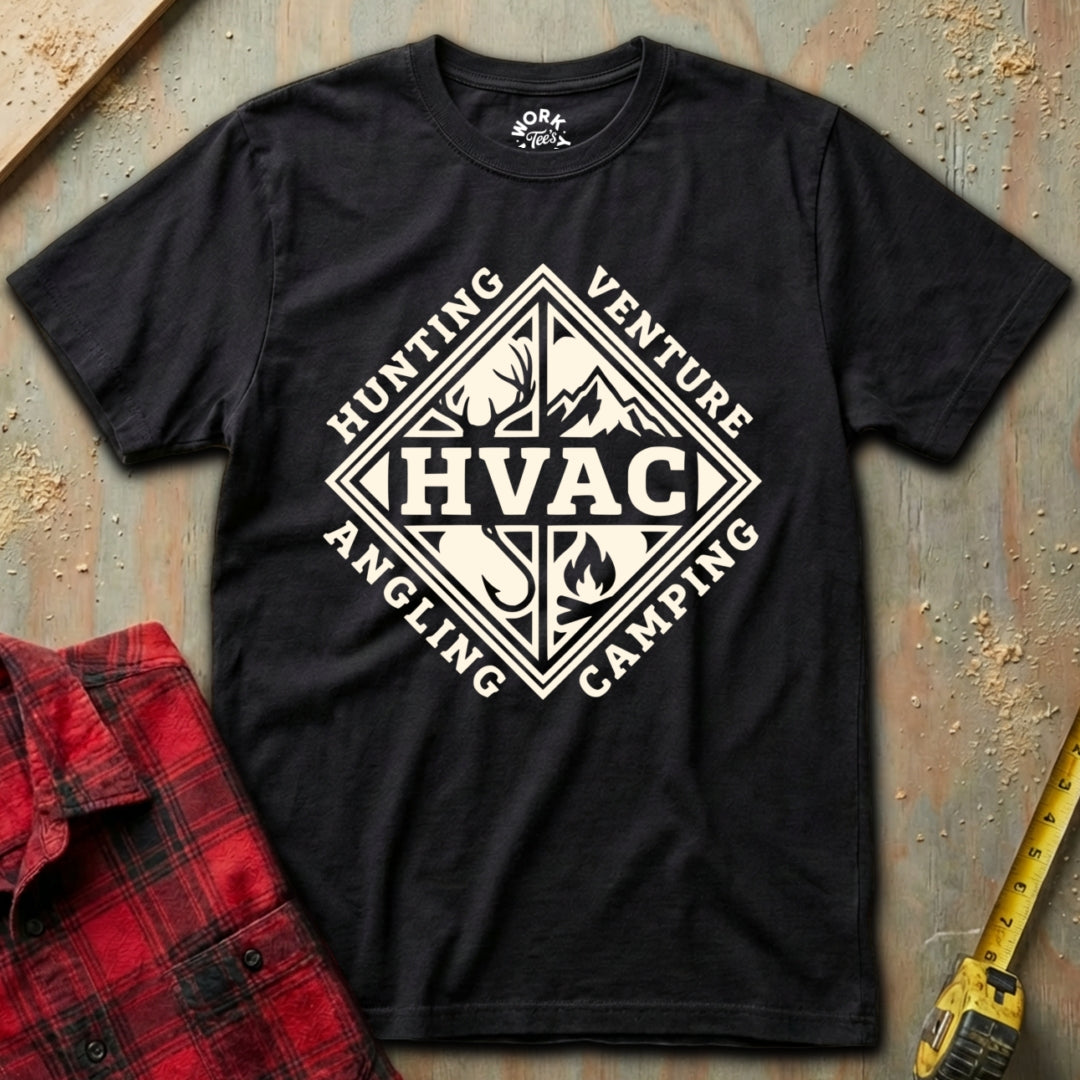 Black t-shirt with white graphic design on a textured surface with red plaid shirt and yellow tool in background
