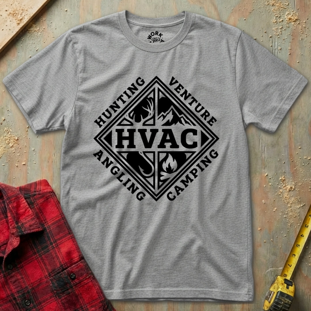 Grey t-shirt with white graphic design on a textured surface with red plaid shirt and yellow tool in background