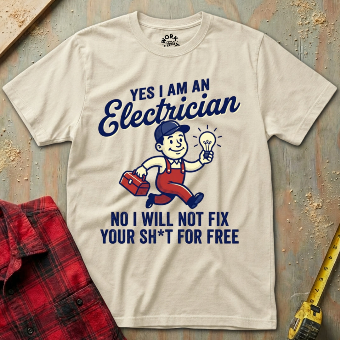 Beige t-shirt with electrician graphic and text on a textured surface with tools.