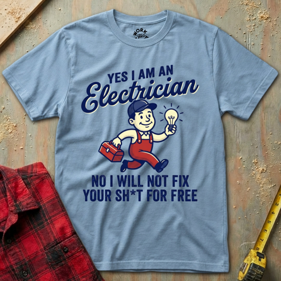 Gray t-shirt with electrician graphic and text on a wooden surface with tools.