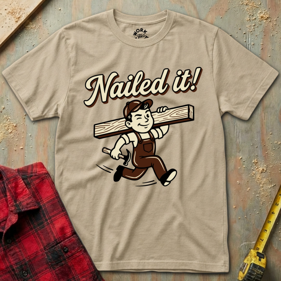Beige t-shirt with 'Nailed it!' graphic on a wooden background