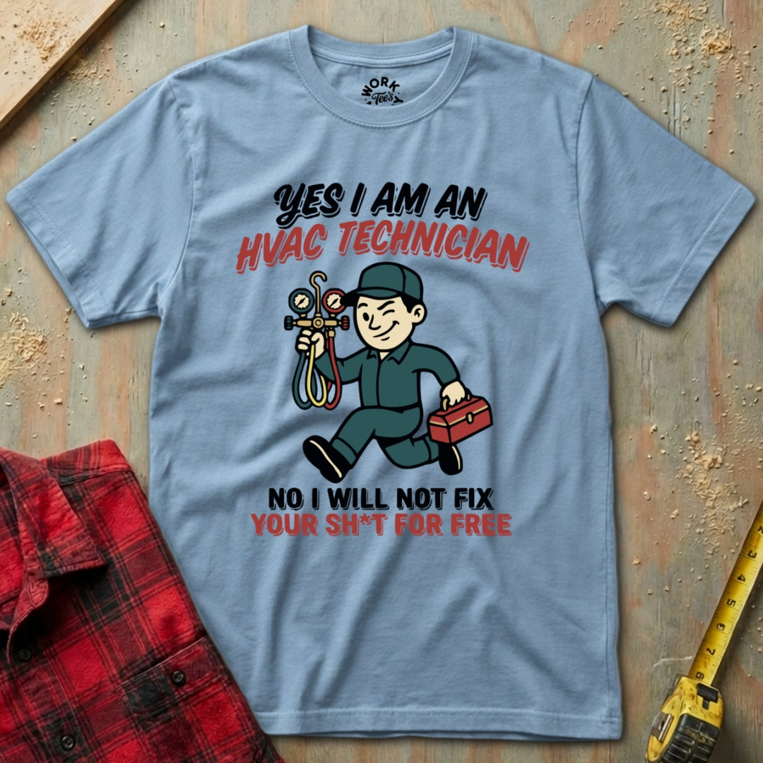 Gray t-shirt with HVAC technician graphic and text on a wooden surface with tools.