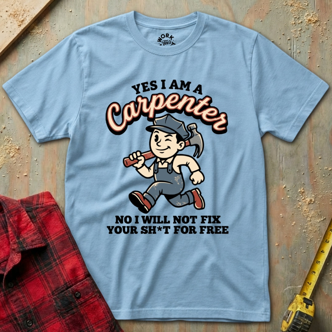 Light blue t-shirt with a carpenter graphic and text on a wooden surface.