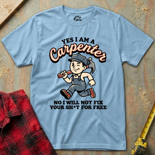 Light blue t-shirt with a carpenter graphic and text on a wooden surface.