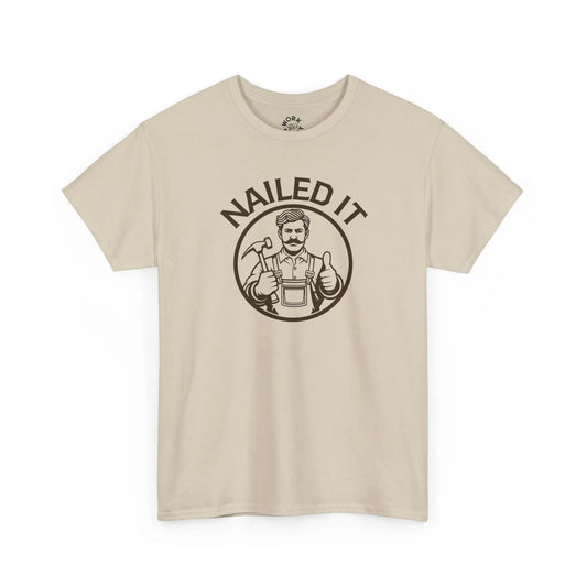 Beige t-shirt with 'Nailed It' graphic on a white background