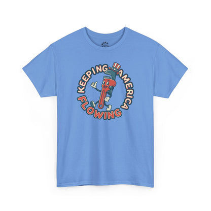 Blue t-shirt with a graphic design of a character holding a bottle labeled 'Keeping America Flowing' on a white background.