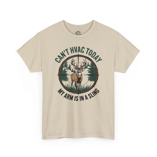 Beige t-shirt with a graphic of a deer and text 'Can't HVAC Today, My Arm is in a Sling' on a white background