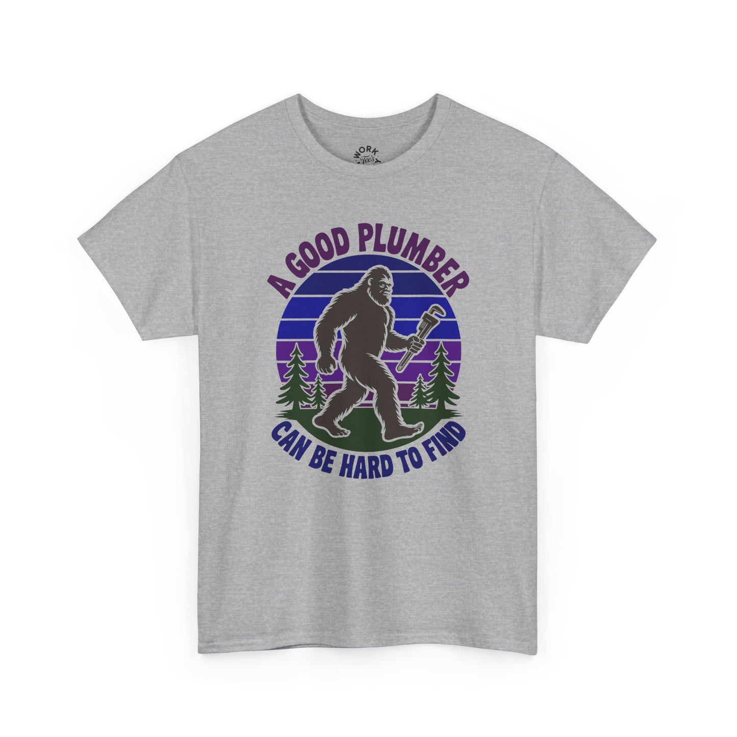 Gray t-shirt with a graphic of a bigfoot holding a wrench and text 'A good plumber can be hard to find' on a white background.