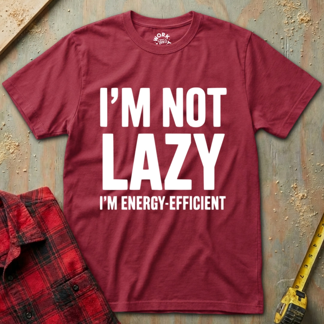 Maroon t-shirt with 'I'm not lazy, I'm energy-efficient' text on a rustic background