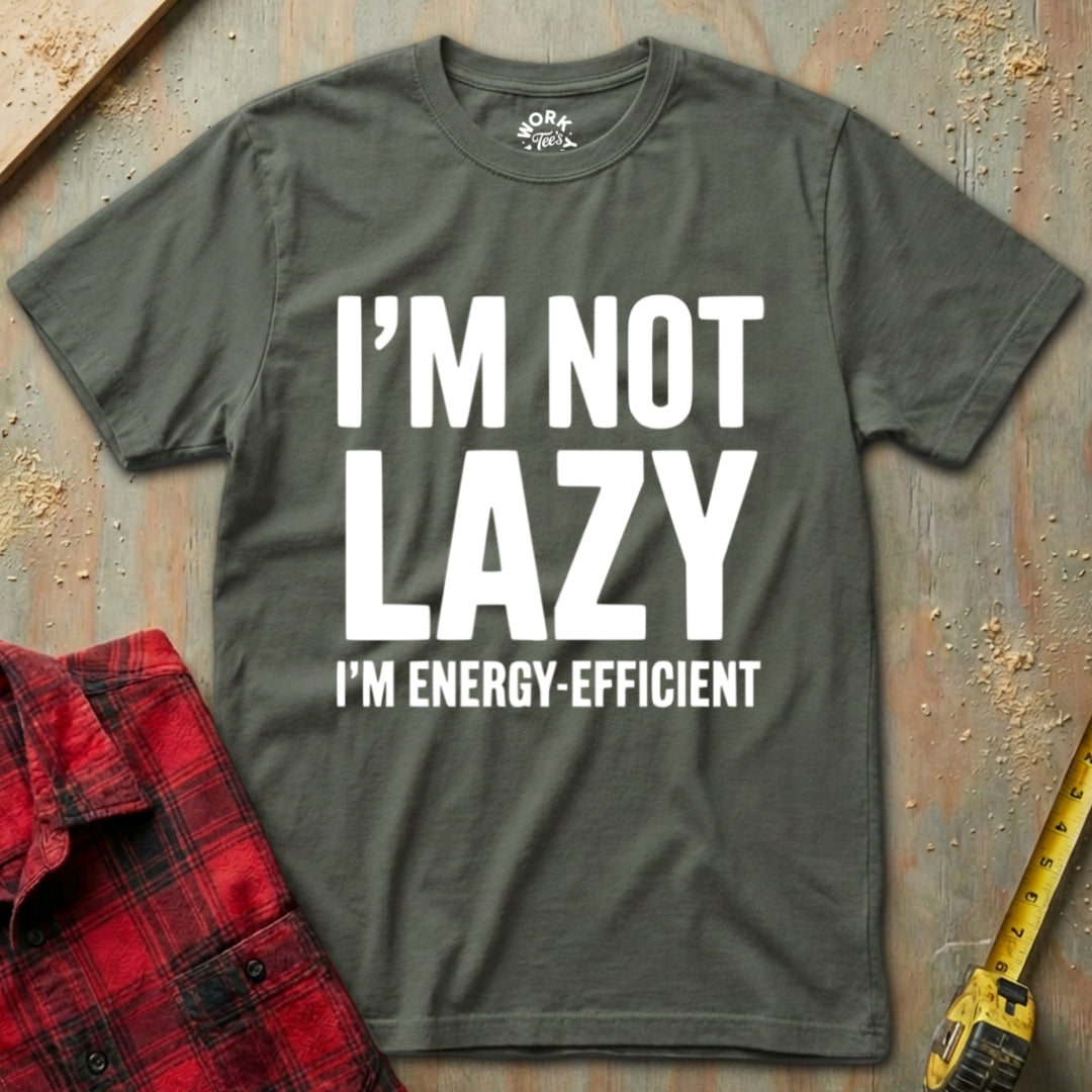 Gray t-shirt with 'I'm not lazy, I'm energy-efficient' text on a rustic wooden background.