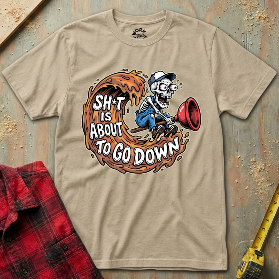 Beige t-shirt with a graphic design featuring a skeleton and text on a wooden surface.