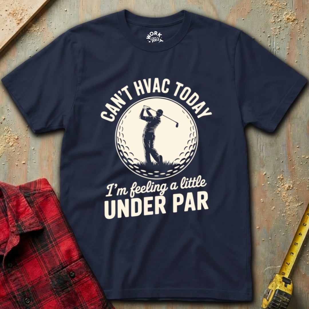 Navy blue t-shirt with golf-themed text and graphic on a textured surface with a red shirt and yellow tool.