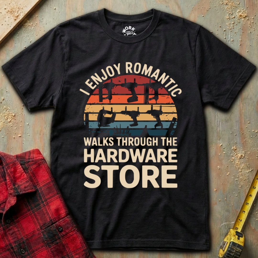 Black t-shirt with humorous graphic and text on a textured surface with plaid shirt and tape measure.