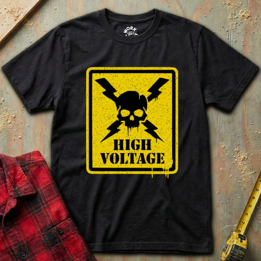 Black t-shirt with a high voltage sign design on a textured surface with a red plaid shirt and yellow tool.