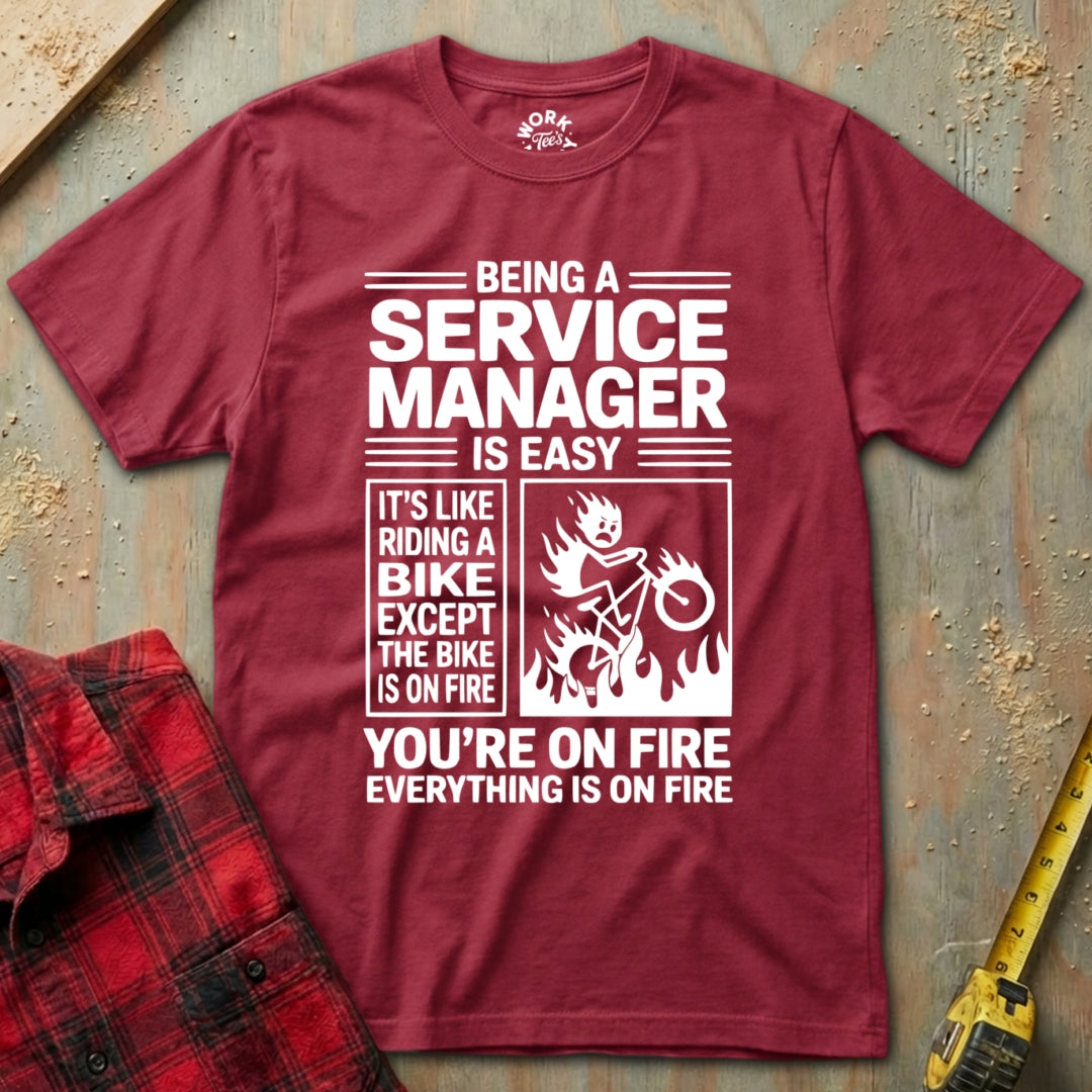 Red t-shirt with humorous text design on a textured surface
