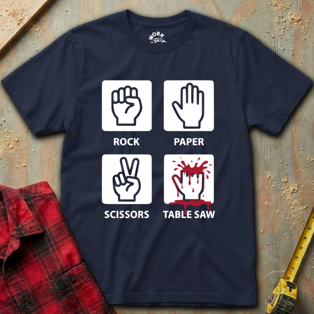 Navy blue t-shirt with rock-paper-scissors and table saw graphic on a textured surface.
