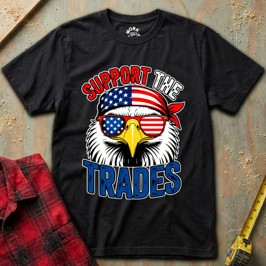 Black t-shirt with an eagle graphic and 'Support the Trades' text on a textured surface.