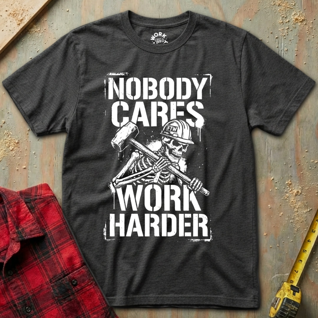 Black t-shirt with skeleton graphic and 'Nobody Cares Work Harder' text on a textured surface.